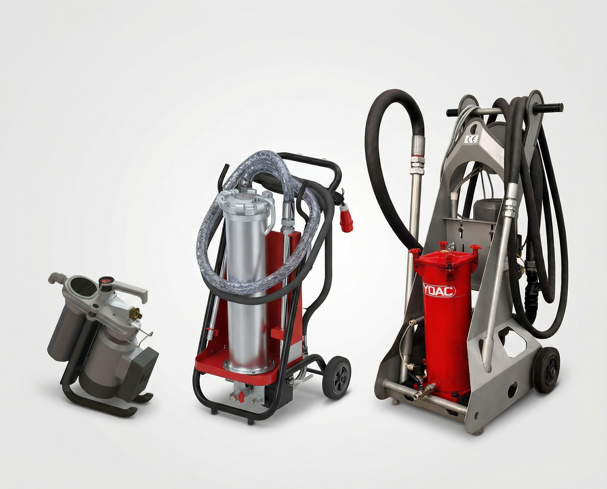 Drei mobile Hydraulik-Filteraggregate zur Reinigung von Hydrauliköl in Industrieanlagen auf neutralem Hintergrund.